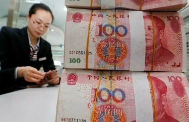 Рекордное падение китайской валюты спровоцировало обвал на фондовых рынках мира