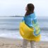 жінка море берег український прапор