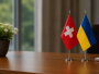 правори Швейцарії та України, вазон, стіл, вікно